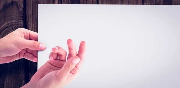 Cropped hands gesturing against white paper — Stock Photo, Image