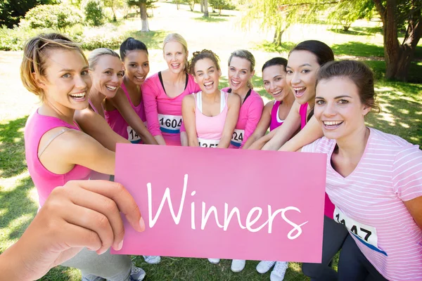 Winners against smiling women running — Stock Photo, Image