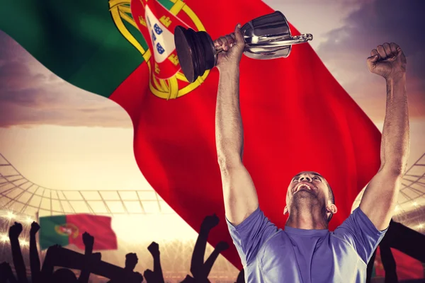 Happy rugby player holding trophy — Stock Photo, Image