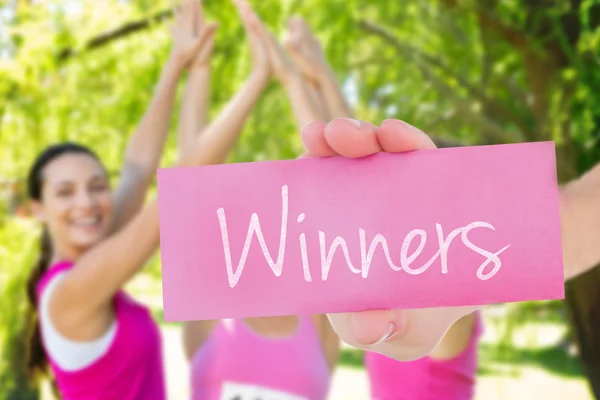 Winners against smiling women — Stock Photo, Image