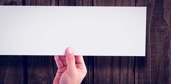Cropped hand showing blank paper — Stock Photo, Image