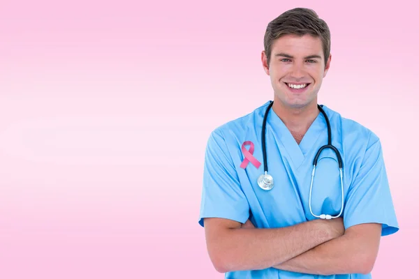 Young nurse in blue tunic with arms crossed — Stock Photo, Image