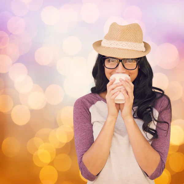 Composite image of brunette with disposable cup — Stock Photo, Image