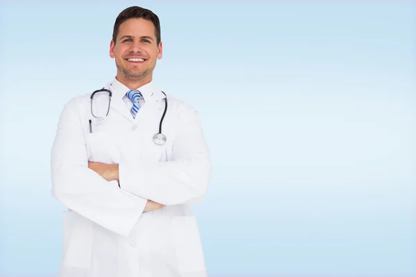 Handsome doctor with arms crossed — Stock Photo, Image