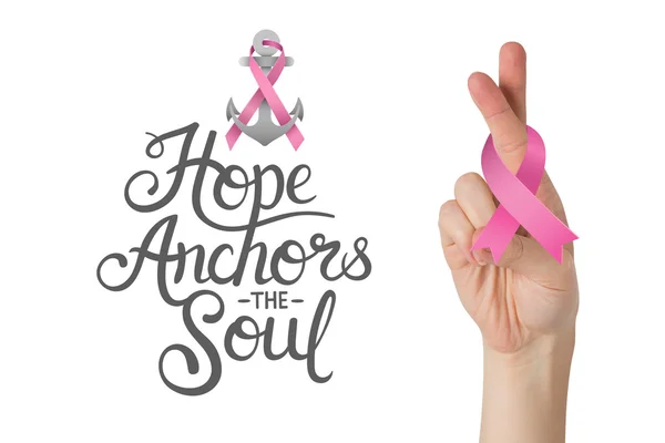 Crossed fingers with breast cancer ribbon — Stock Photo, Image