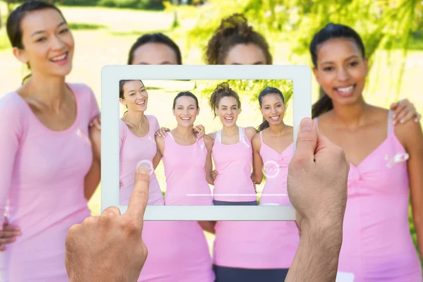 Composite image of hand holding tablet pc — Stock Photo, Image