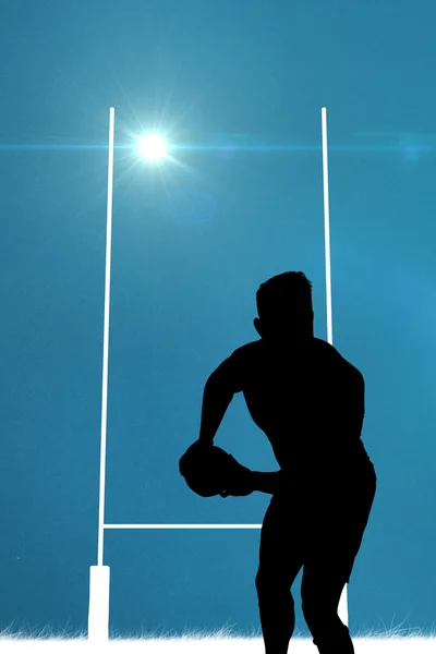 Composite image of silhouette of rugby player — Stock Photo, Image