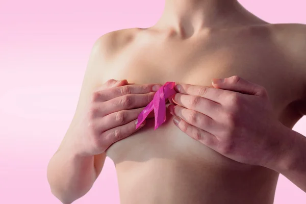 Nude woman with breast cancer ribbon — Stock Photo, Image