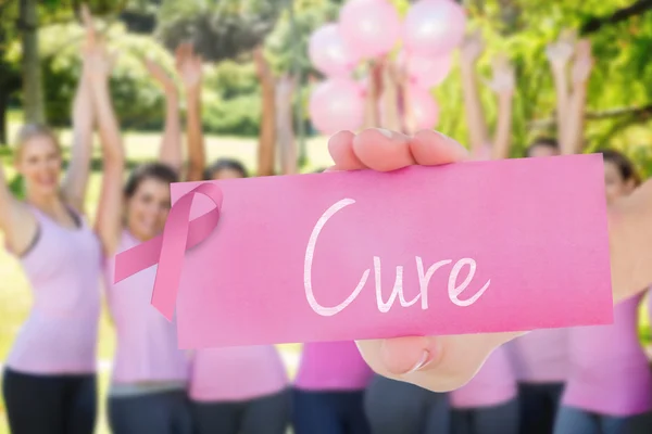 Cure against smiling women in pink — Stock Photo, Image