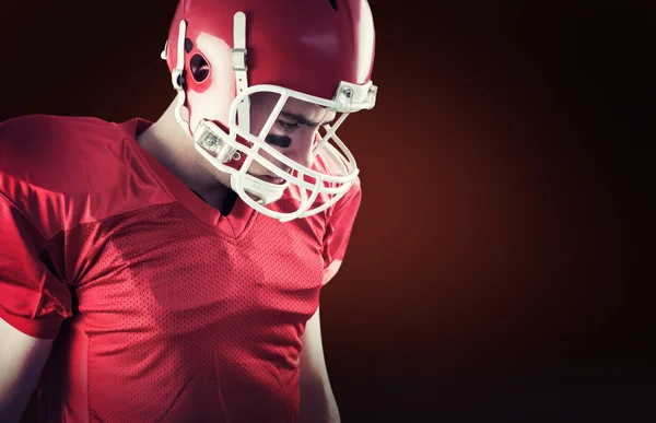 American football player taking his helmet — Stock Photo, Image