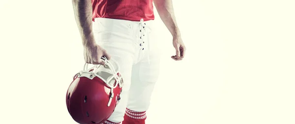 Amerykański piłkarz trzyma jego kask — Zdjęcie stockowe