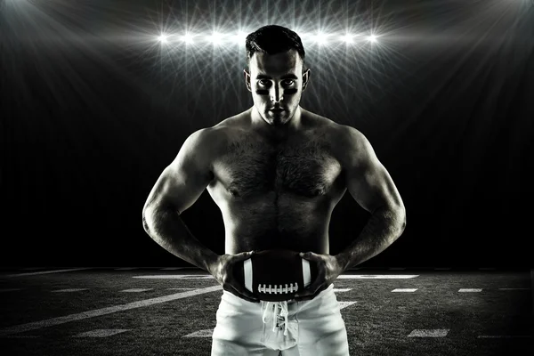 Shirtless american football player with ball — Stock Photo, Image