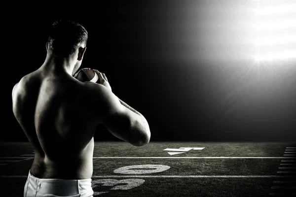 Shirtless american football player with ball — Stock Photo, Image