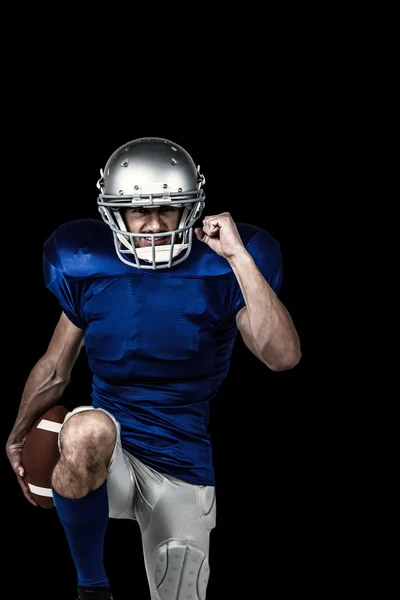 Giocatore di football americano in piedi su una gamba — Foto Stock