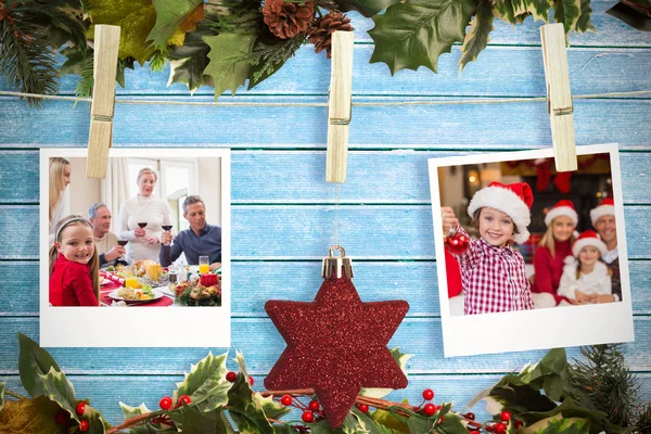 Opknoping kerst foto's tegen houten planken — Stockfoto