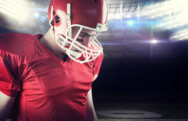 American football player taking his helmet — Stock Photo, Image