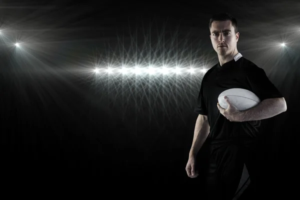 Rugby player holding a rugby ball — Stock Photo, Image