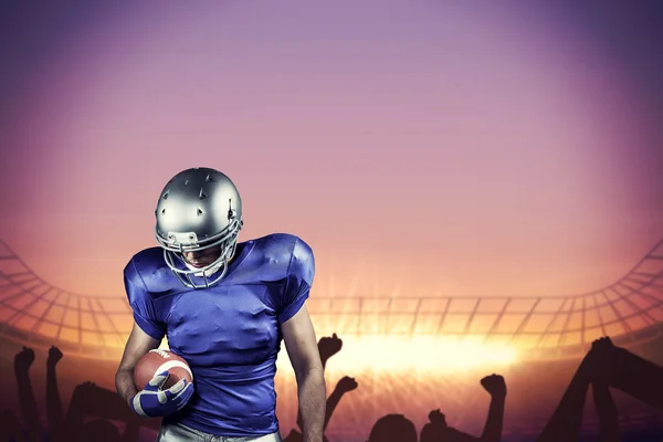 American football player looking down — Stock Photo, Image