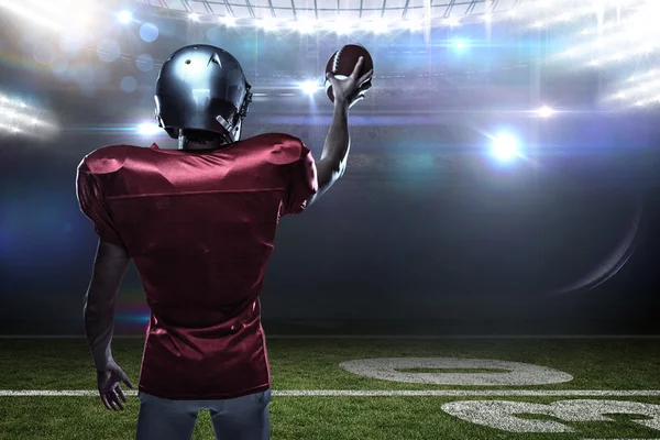 Sportsman in red jersey holding ball — Stock Photo, Image