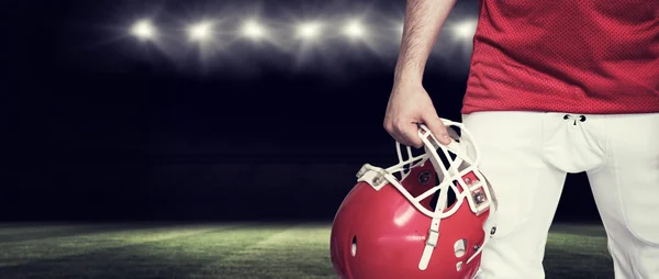 American football player holding a helmet — Stock Photo, Image