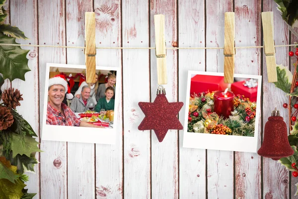 Hanging christmas photos against wooden planks — Stock Photo, Image