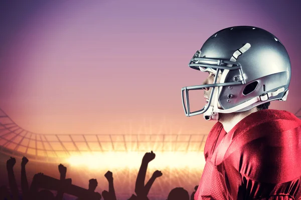 Sportsman standing against football stadium with cheering crowd — Stock Photo, Image