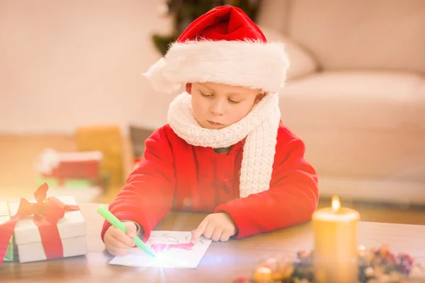 Festive little boy drawing pictures — Stock Photo, Image