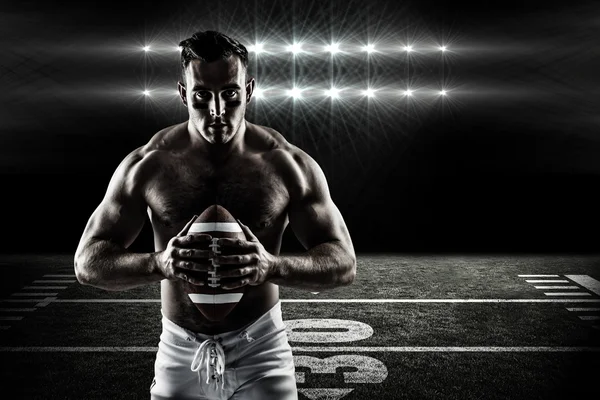 Shirtless American football player with ball — Stock Photo, Image