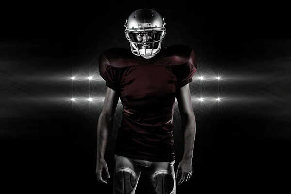 American football player against spotlights — Stock Photo, Image