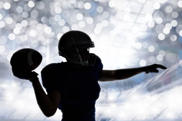 American football player throwing ball — Stock Photo, Image