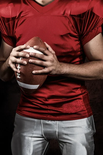 American football player holding ball — Stock Photo, Image