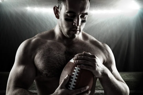 Shirtless American football player with ball — Stock Photo, Image