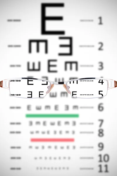 Glasses against eye test — Stock Photo, Image