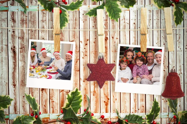 Hanging christmas photos against wooden background — Stock Photo, Image