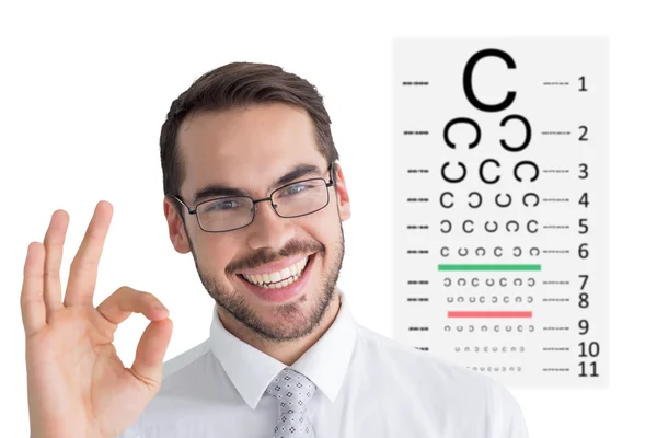 Uomo d'affari fare gesto giusto contro il test degli occhi — Foto Stock