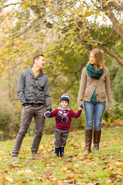 Smiling young couple with little boy laughing — Stock Photo, Image