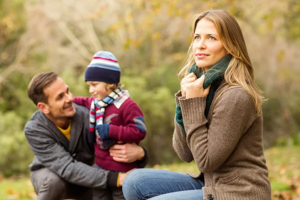 Smiling young couple with little boy posing — Stock Photo, Image