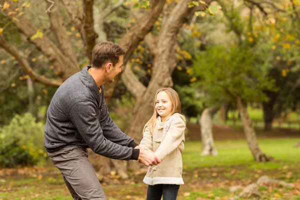Cute little girl playing with her father — Stock Photo, Image