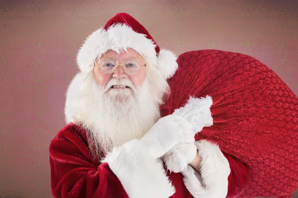 Immagine composita di Babbo Natale allegro porta il suo sacco — Foto Stock