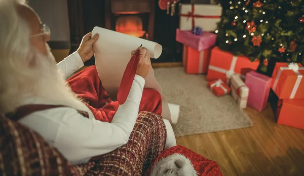 Santa claus holding his list — Stock Photo, Image