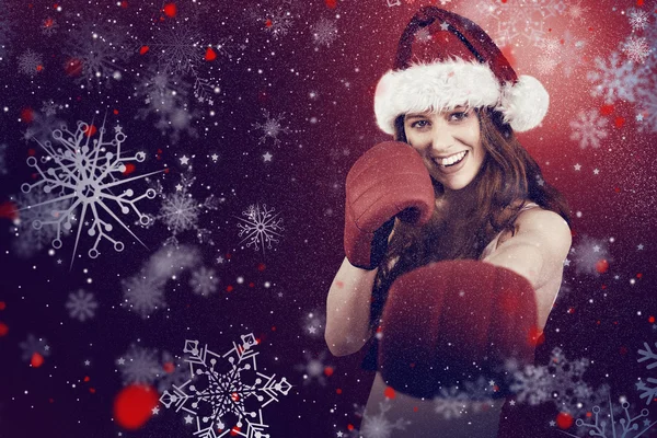 Festive redhead punching with boxing gloves — Stock Photo, Image