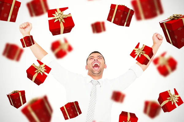 Composite image of cheering businessman — Stock Photo, Image