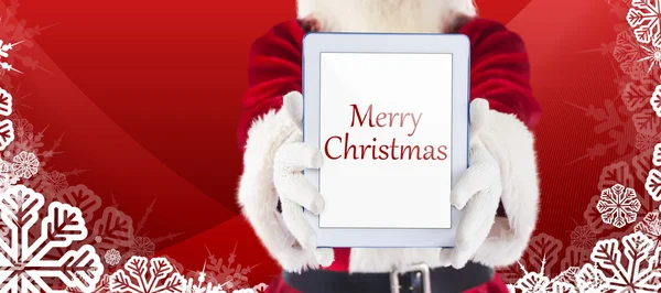 Santa presenterar en tablet Pc — Stockfoto