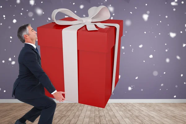 Stylish man with giant gift — Stock Photo, Image