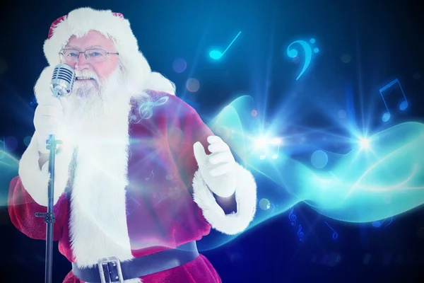 Santa claus is singing christmas songs — Stock Photo, Image