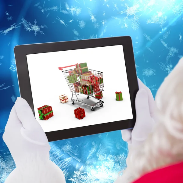Изображение Санта-Клауса с помощью планшетного компьютера — стоковое фото