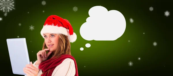 Festive blonde looking at tablet pc — Stock Photo, Image