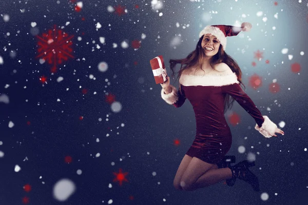 Rossa festiva che salta con regalo — Foto Stock