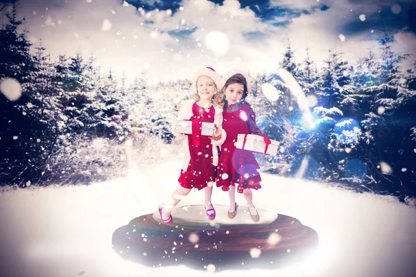 Imagen compuesta de niño festivo en bola de nieve —  Fotos de Stock