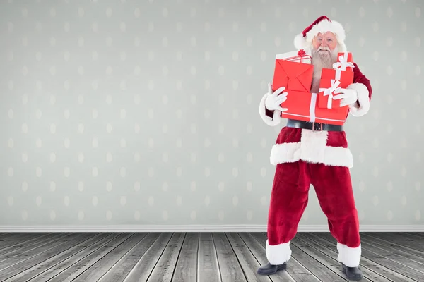 Santa carrying gifts — Stock Photo, Image